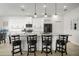 Modern kitchen with white cabinets, granite countertops, stainless steel appliances, and island seating at 5460 Sandy Shell Dr, Apollo Beach, FL 33572
