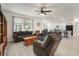 Open-concept living room with hardwood floors and view of kitchen island at 5460 Sandy Shell Dr, Apollo Beach, FL 33572