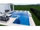An eye-level rendering shows a luxury pool and jacuzzi including in-water seating next to an outdoor lounge area and backyard at 5460 Sandy Shell Dr, Apollo Beach, FL 33572