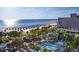 Beautiful aerial view of a hotel, beach, pool, and ocean on a sunny day at 5500 Gulf Blvd # 4228, St Pete Beach, FL 33706
