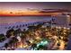 Aerial view of hotel, swimming pool, beach, and ocean at sunset at 5500 Gulf Blvd # 4228, St Pete Beach, FL 33706