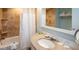 Well-maintained hotel bathroom featuring a shower/tub combo and granite countertop at 5500 Gulf Blvd # 4228, St Pete Beach, FL 33706