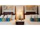 Close-up of hotel bedroom showcasing the headboards and patterned accent pillows at 5500 Gulf Blvd # 4228, St Pete Beach, FL 33706