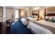 Inviting hotel bedroom with two beds, cool blue carpet, and sliding doors to a balcony at 5500 Gulf Blvd # 4228, St Pete Beach, FL 33706