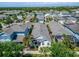 Brightly colored single-Gathering homes with lush green trees in a well-planned community at 606 Winterside Dr, Apollo Beach, FL 33572