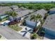 Charming single-story home with a two-car garage, palm trees, and well-maintained landscaping at 606 Winterside Dr, Apollo Beach, FL 33572