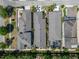 Bird's eye view of tightly packed homes with manicured lawns, grey roofs, and in ground pools at 606 Winterside Dr, Apollo Beach, FL 33572