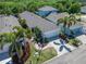 Charming single-story home with a two-car garage, palm trees, and well-maintained landscaping at 606 Winterside Dr, Apollo Beach, FL 33572