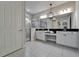 Modern bathroom with double vanity, granite countertops, and glass-enclosed walk-in shower at 606 Winterside Dr, Apollo Beach, FL 33572