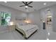 Spacious bedroom with bright light, neutral decor, and an ensuite bathroom with double vanity at 606 Winterside Dr, Apollo Beach, FL 33572