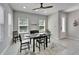 Modern dining room with a table set, tile floors, recessed lights, and natural lighting at 606 Winterside Dr, Apollo Beach, FL 33572