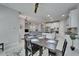 Open concept dining and living area featuring modern decor and an eat-in kitchen island at 606 Winterside Dr, Apollo Beach, FL 33572