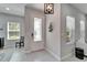 Welcoming entryway with a decorative front door, tile flooring, and natural light at 606 Winterside Dr, Apollo Beach, FL 33572
