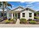 Charming single-story home with a welcoming front porch and well-manicured landscaping at 606 Winterside Dr, Apollo Beach, FL 33572
