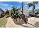 A charming single-Gathering home with a lushly landscaped front yard and a convenient two-car garage at 606 Winterside Dr, Apollo Beach, FL 33572