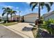 This inviting single-Gathering home includes a driveway, attached garage, manicured lawn, and lovely landscaping at 606 Winterside Dr, Apollo Beach, FL 33572