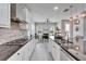 Well-lit kitchen featuring stainless steel appliances, granite countertops, and a center island at 606 Winterside Dr, Apollo Beach, FL 33572