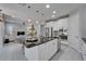 Open kitchen with granite countertops, stainless steel appliances, a large island, and ample cabinet space at 606 Winterside Dr, Apollo Beach, FL 33572