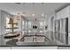 Open concept kitchen features stainless appliances, an eat-in island, and views of living area at 606 Winterside Dr, Apollo Beach, FL 33572