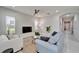 Comfortable living room with stylish furniture, neutral tones, and ample natural light at 606 Winterside Dr, Apollo Beach, FL 33572
