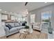 Bright living room featuring a contemporary design, comfortable seating, and tile flooring at 606 Winterside Dr, Apollo Beach, FL 33572