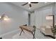 Well-lit office featuring a modern desk, comfortable chair, ample storage, and stylish decor at 606 Winterside Dr, Apollo Beach, FL 33572