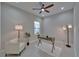 Cozy office with a modern chair, desk, neutral decor, and plenty of natural light at 606 Winterside Dr, Apollo Beach, FL 33572