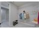 Organized walk-in closet with ventilated shelving and easy access from main bedroom and bathroom at 606 Winterside Dr, Apollo Beach, FL 33572