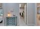Walk-in closet with custom shelving, rod space, and convenient access from the main bedroom at 606 Winterside Dr, Apollo Beach, FL 33572