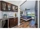 Built-in bar area that transitions to a bedroom, showcasing storage and natural light at 6141 Bahia Del Mar Blvd # 129, St Petersburg, FL 33715