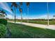 Scenic golf course with lush green fairways, palm trees, and a blue sky at 6141 Bahia Del Mar Blvd # 129, St Petersburg, FL 33715