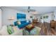 Open living area with modern decor, sleek flooring, and a view to dining area at 6141 Bahia Del Mar Blvd # 129, St Petersburg, FL 33715