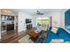 Living room features modern decor, sleek flooring, and sliding doors to the outside view at 6141 Bahia Del Mar Blvd # 129, St Petersburg, FL 33715