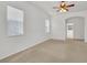 A carpeted bedroom has natural light at 6205 Ibispark Dr, Lithia, FL 33547