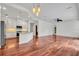 Open-concept kitchen with white cabinets, stainless appliances, and expansive counter space at 6205 Ibispark Dr, Lithia, FL 33547