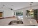 Open kitchen with island sink, great view of outdoor pool, and connected floor plan at 6205 Ibispark Dr, Lithia, FL 33547