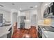 Modern kitchen featuring granite countertops, stainless steel appliances, and custom white cabinets at 6205 Ibispark Dr, Lithia, FL 33547