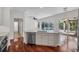 A bright and spacious kitchen island with stainless steel appliances and a pool view at 6205 Ibispark Dr, Lithia, FL 33547