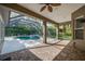 Covered patio overlooking a screened-in pool area, perfect for outdoor entertaining at 6205 Ibispark Dr, Lithia, FL 33547