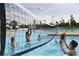 Community pool area with volleyball net, perfect for active recreation and socializing at 6205 Ibispark Dr, Lithia, FL 33547