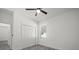 Neutral bedroom with wood-look floors, bi-fold closet, and a ceiling fan at 6302 N 39Th St, Tampa, FL 33610
