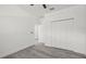 Bright bedroom featuring wood-look floors, neutral paint, and a closet at 6302 N 39Th St, Tampa, FL 33610