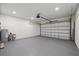 Spacious two-car garage featuring epoxy flooring and an insulated door at 6302 N 39Th St, Tampa, FL 33610