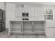 Open kitchen with a large center island, shaker cabinets, and stainless steel appliances at 6302 N 39Th St, Tampa, FL 33610
