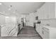 Spacious kitchen with white cabinets, stainless steel appliances, and a large marble countertop island at 6302 N 39Th St, Tampa, FL 33610