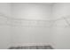 Empty walk-in closet with metal shelving, ready for organization and storage at 6302 N 39Th St, Tampa, FL 33610