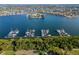 Picturesque marina view with boats docked on the water, surrounded by lush greenery and beautiful homes at 6317 Marbella Blvd, Apollo Beach, FL 33572