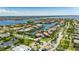 Wide aerial view showcasing canal access, landscaping, and neighborhood at 6317 Marbella Blvd, Apollo Beach, FL 33572