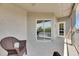 Cozy covered balcony provides a serene outdoor space with comfortable seating and a calming ambiance at 6317 Marbella Blvd, Apollo Beach, FL 33572
