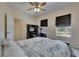 Comfortable bedroom with natural light, featuring modern furniture and a ceiling fan at 6317 Marbella Blvd, Apollo Beach, FL 33572